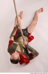 MARCUS LAYING POSE WITH SPEAR